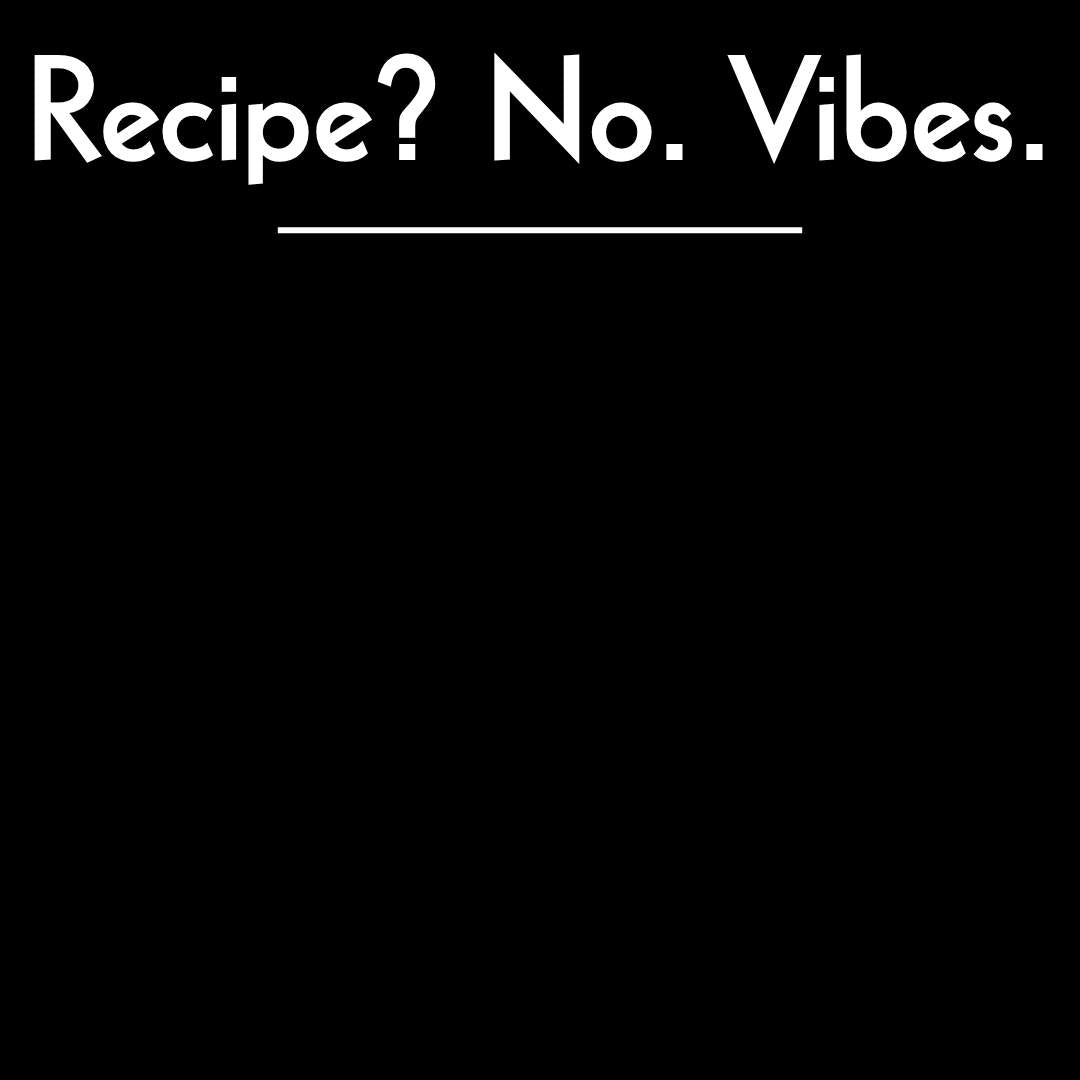 Close-up of the “Recipe? No. Vibes.” text design on a black apron, showing the print texture and modern minimalist style.